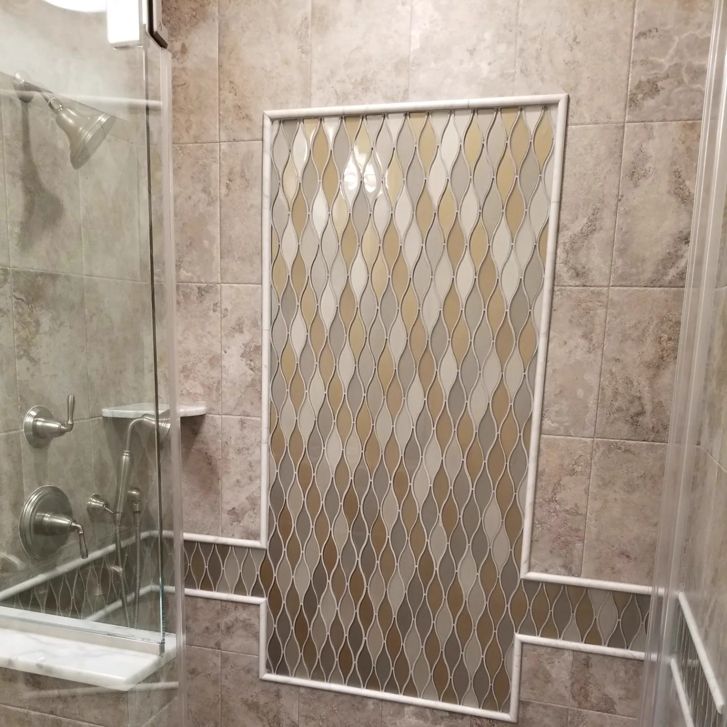 Shower accent panel in a diamond mosaic pattern